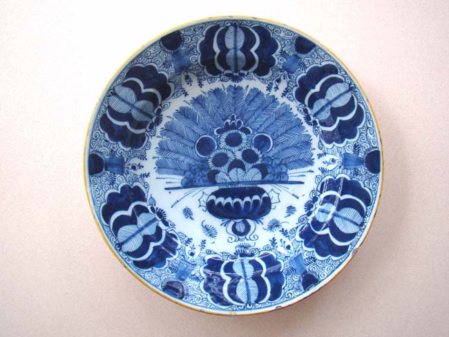 An 18th century Dutch Delft Charger in the 'peacock' pattern made by De Porceleyne Claew factory circa 1760